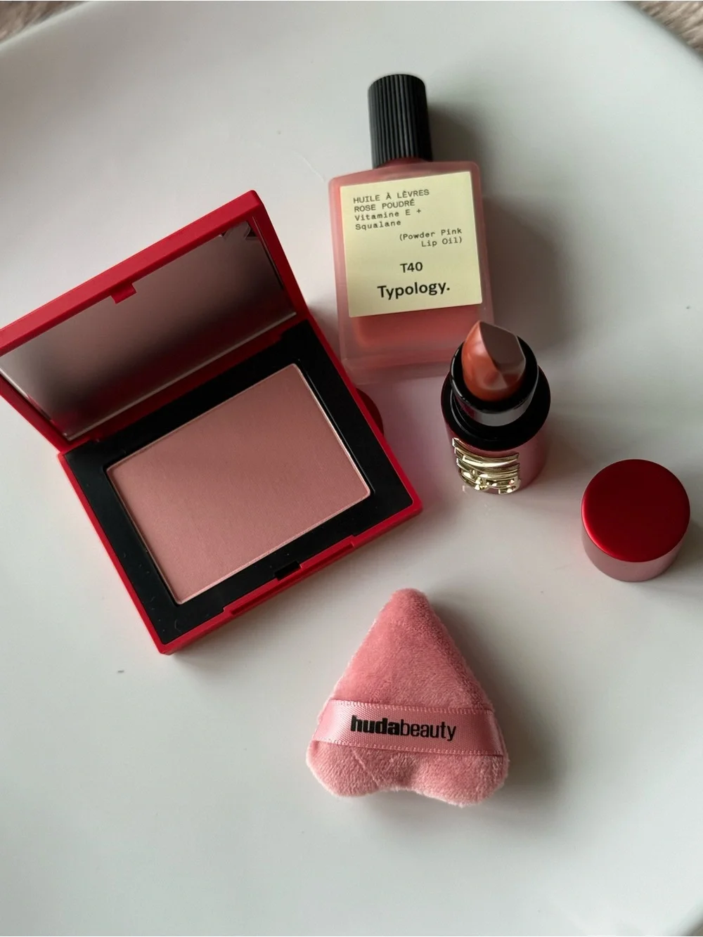 NARS Blush & Lipstick + Typology Lip Oil + Huda Puff